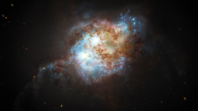 合体過程にある銀河とその中心部に存在するクエーサーの想像図